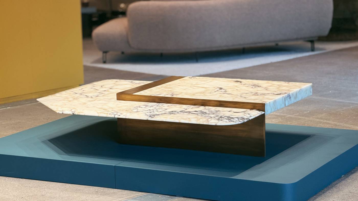 HESSENTIA Talos coffee table with marble top and metal base displayed at Firma Casa