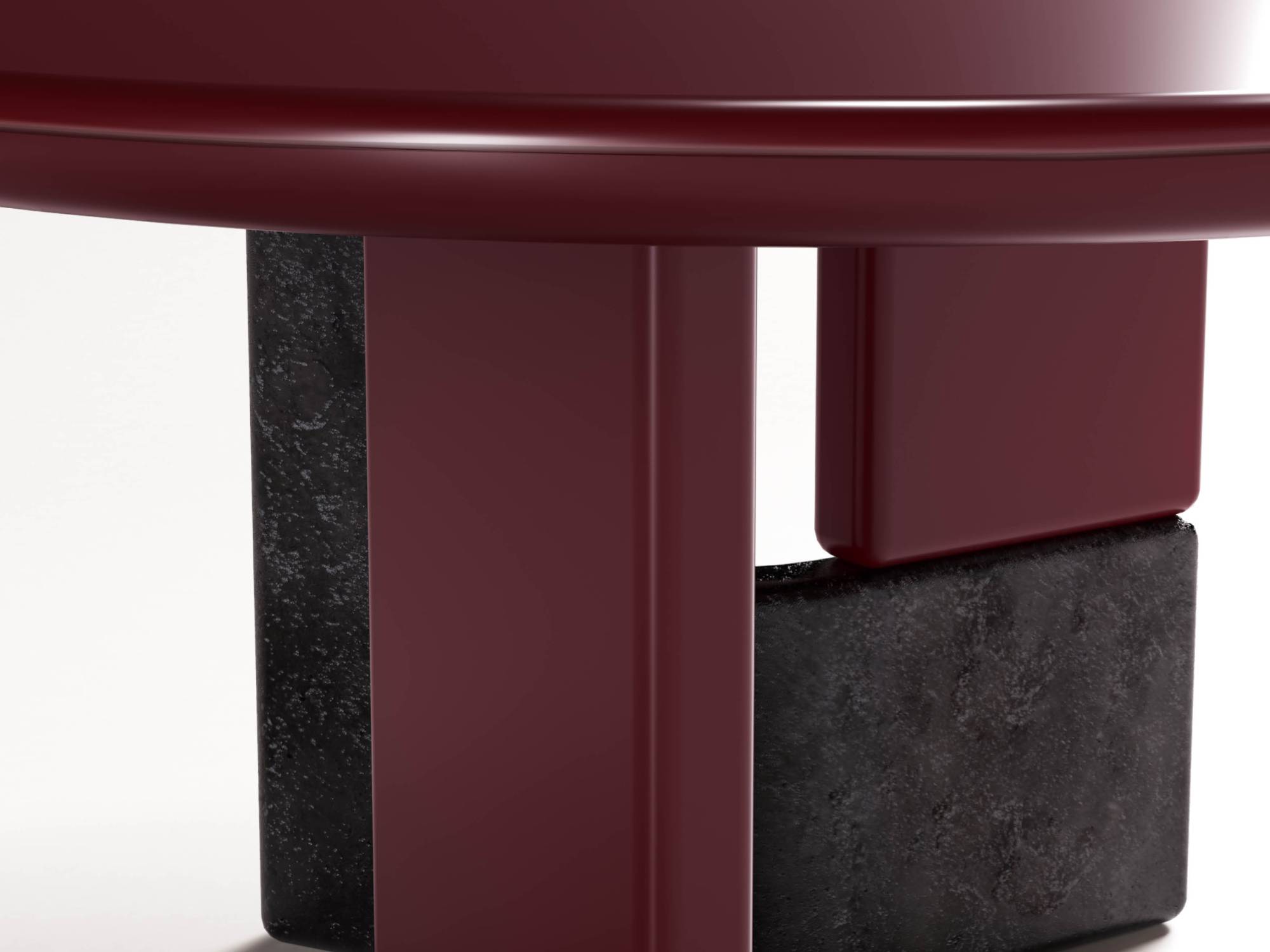 Ovoo dining table detail showing amaranto supports and textured dark base